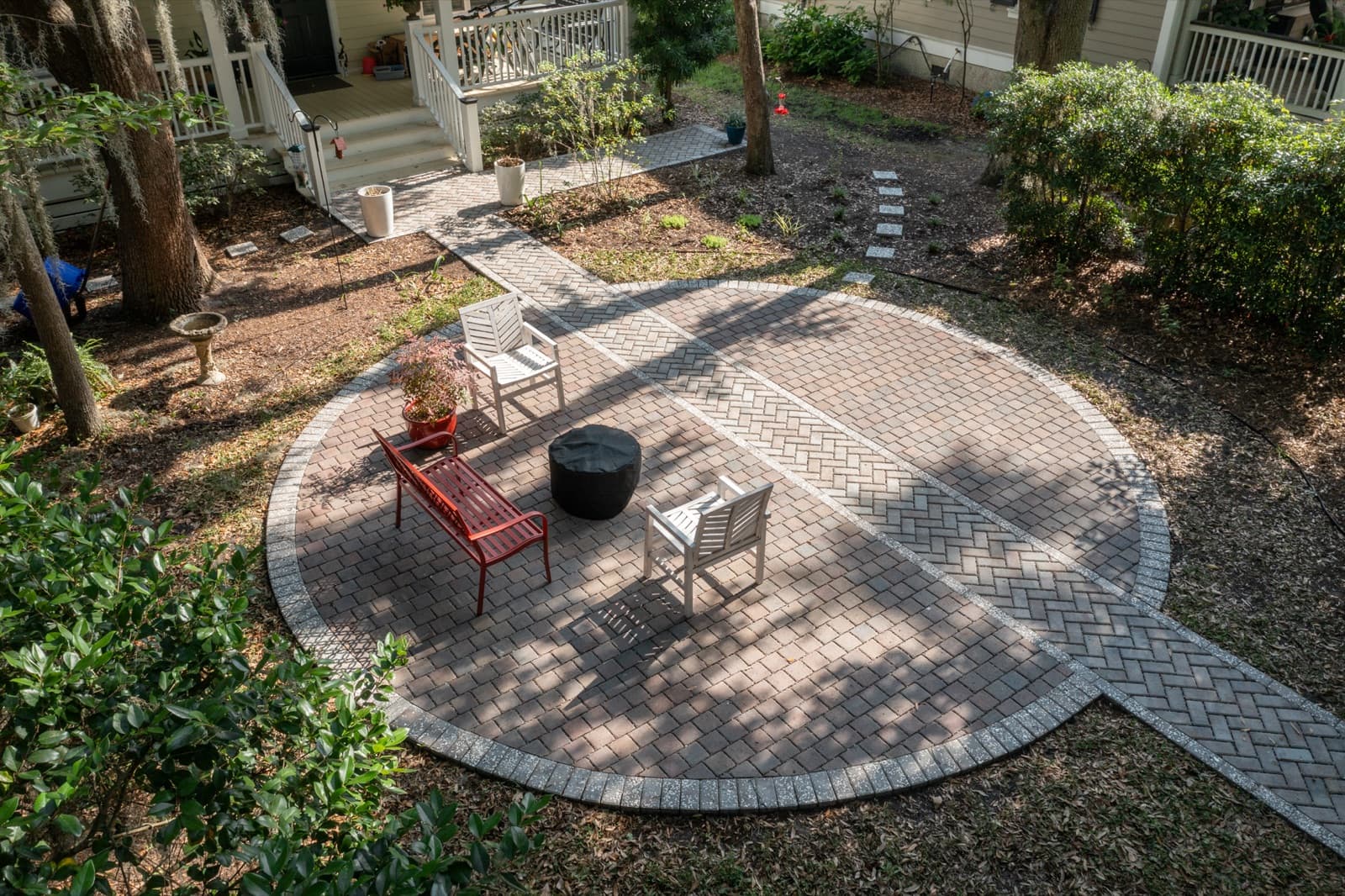 The finished circular patio and path connecting back to the porch of the Port Royal home
