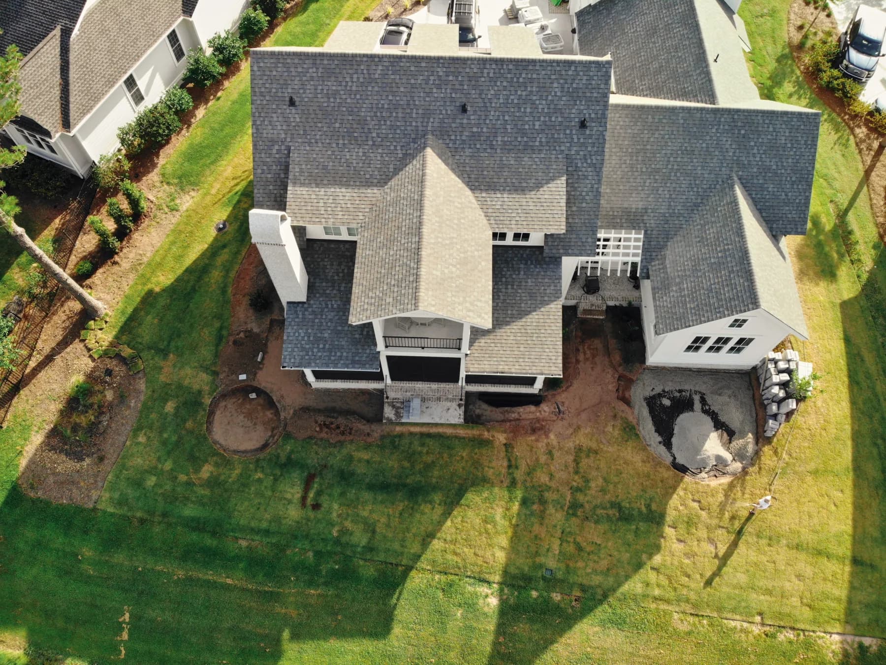 Aerial construction view after the landscape beds were reshaped and the two patio zones were excavated