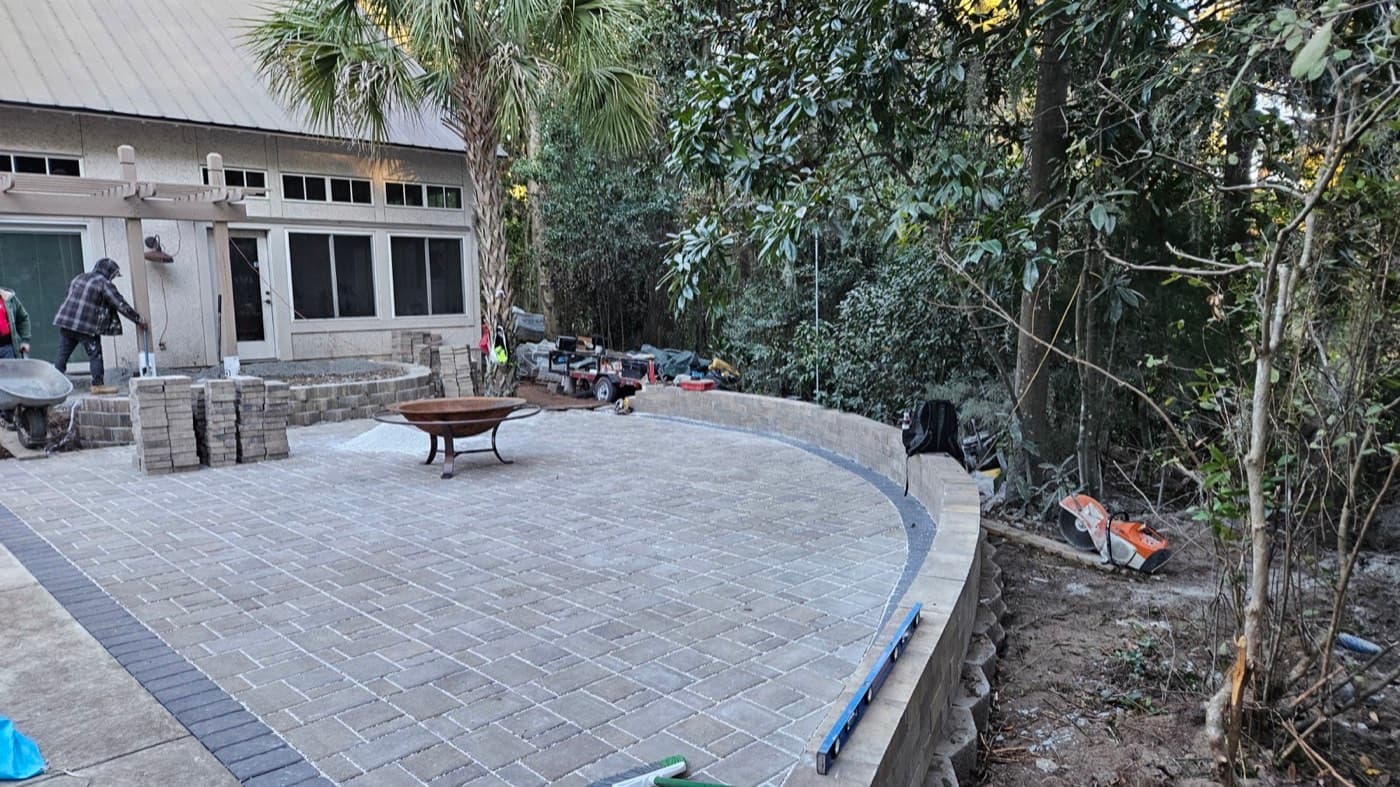 Multi-level paver patio with steps connecting separate outdoor living zones