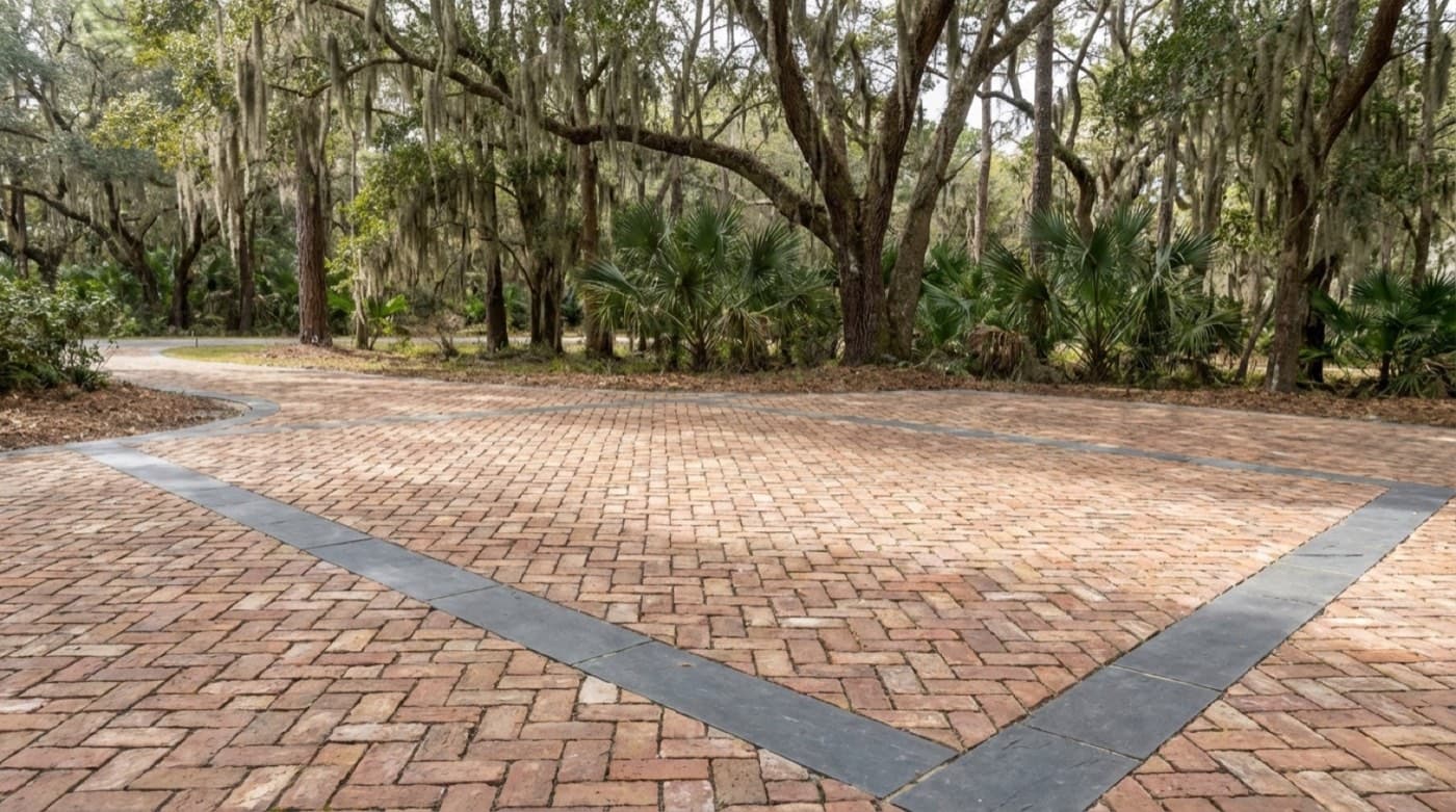 Paver base preparation and material layout for a driveway
