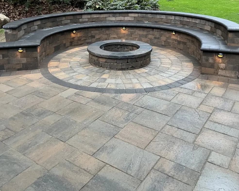 Circular paver patio with fire pit and seating wall